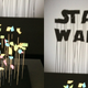 Why yes, that is a Star Wars logo made from pieces of perfectly coordinated trash on sticks in artist “Red” Hong Yi’s work.